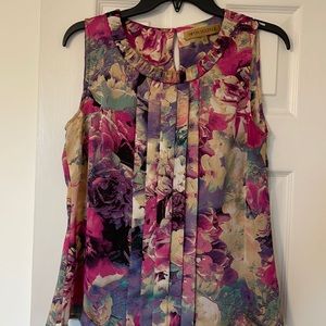 Beautiful floral sleeveless blouse. In excellent like-new condition.